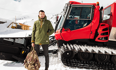 young-hipster-man-hiking-mountains-winter-vacation-traveling 1